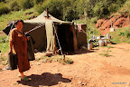 Kyrgyz lady in front of her home