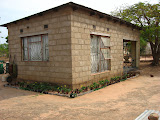 And a FINAL picture of our house in South Africa... it was home for over two years and despite some of the inconveniences and uncomfortablities (at times), it was home and we miss it. We finally got a water tap in our yard and I was able to use it to really take care of my garden during the last couple of months, and even got a nice decorative garden planted around the edge of the house. South Africa - 457.jpg