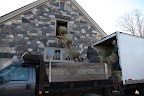 The conveyor was lowered and look how easy it makes getting those heavy bales up into the hay loft!  The chain has big hooks, which grip the bales for transport.