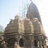 View of the temple from south-west. The temple consists mukha-mandapa, mandapa, antarala and garbha-griha. The stone pierced windows are similar as in western Indian temple style. The temple has a three-entrance mandapa, the main entrance is in east.