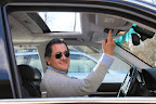 And look, he's even opening the sunroof so we can get even more interesting smelling air!