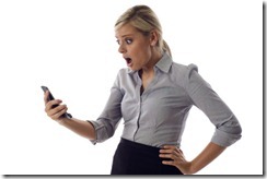 SMS. Funny young businesswoman reading bad news text messag