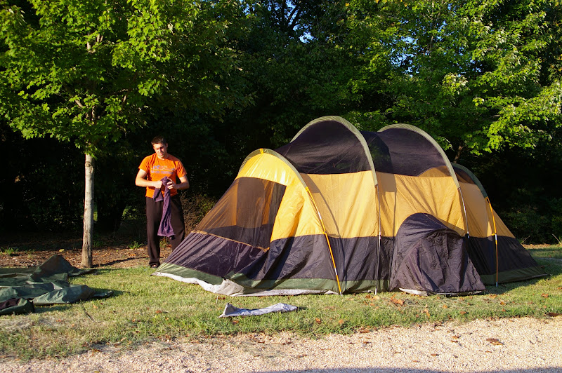 Setting up tent in a community park.