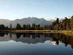 Mount Tasman and Mount Cook beautifully reflects over the Lake Matheson