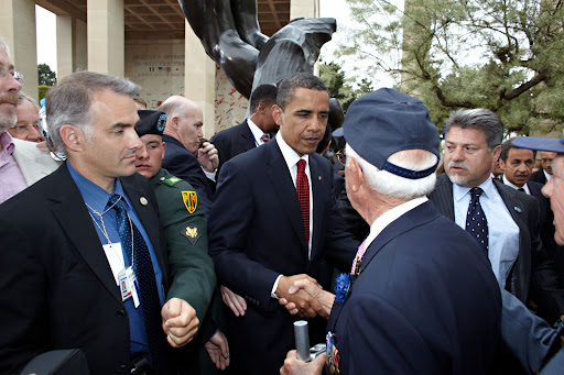 US President Obama greeting Veterans at the 65th Anniversary commemorative celebration on D-Day in Normandy, France, earlier this year. A group of students from College of the Ozarks accompanied a handful of veterans on the trip. (Photo credit: John Riedy)