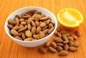 [2388028-bowl-of-fresh-almonds-and-an-orange-on-a-rattan-mat-of-warm-color%255B5%255D.jpg]