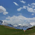 Phil and a passing nomad at a pass, overlooking the north-eastern slopes of the Ferghana Range, Kyrgyzstan.
