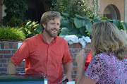 Ben serving veggie dogs at the City of Victoria staff appreciation barbecue