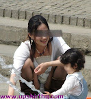 Mummy tending to daughter