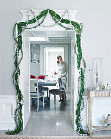 Here pine boughs, magnolia leaves, and mesh-wrapped silver balls hang loosely around a doorway. They work like party streamers and I love the combination of silver and green. Here pine boughs, magnolia leaves, and mesh-wrapped silver balls hang loosely around a doorway. They work like party streamers and I love the combination of silver and green.