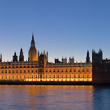 The Palace of Westminster at night as seen from the opposite side of the River Thames