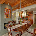 The 11-ft floor-to-ceiling stone fireplace faces both the dining and living rooms.