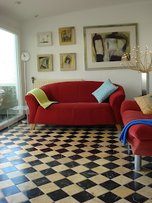 Living room with seatings for 4 persons, 2 sofas, sat-TV, music, DVD, heating, left entrance to own terrace of the apartment, right dining room on one side, writing table on the other one.