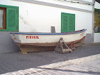 Old fishing boat in the shade Old fishing boat in the shade