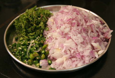 Chopped onion, chilies, and coriander for the ragi roti