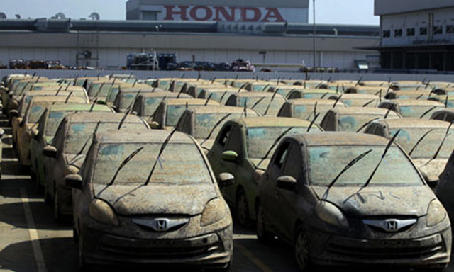 Thailand floods: damaged cars at a Honda plant in central Thailand. Lloyd's of London has taken a $2.2bn hit from the 2011 floods. Apichart Weerawong / AP