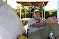 Bob relaxing at Joe River after setting up for the night. Photo