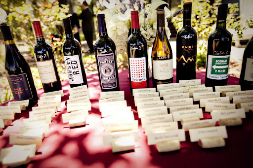 Dinner tables were categorized by wine bottle. Geri's relatives from New Jersey sat the the Jersey Red table; Zach's college buddies were seated at the 47 Friends table. Dinner tables were categorized by wine bottle. Geri's relatives from New Jersey sat the the Jersey Red table; Zach's college buddies were seated at the 47 Friends table.