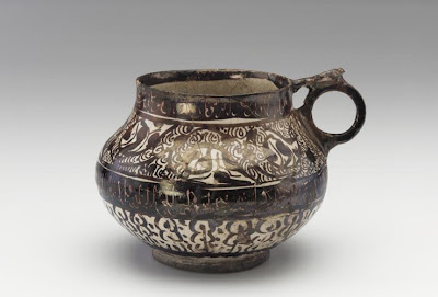 Jar with handle | Origin:  Iran | Period: 1200-1250 | Details:  Not Available | Type: Ceramic Wheel-thrown with applied handle, glazed, and fired | Size: H: 13.7  W: 19.0  cm | Museum Code: S1987.958 | Photograph and description taken from Freer and the Sackler (Smithsonian) Museums.