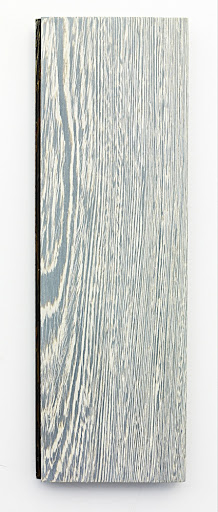 A plainsawn plank with 2 bleach applications and white stain.
