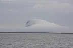 Island shrouded in fog
