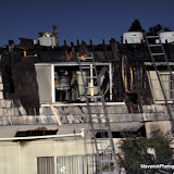 A 3 alarm fire ripped through an apartment complex Wednesday evening in Carmichael on Fair Oaks Blvd near El Camino Ave. Sac Metro Fire Assistant Chief Rice stated that they litterally were chasing the fire around an enclosed part of the roof that ran around the entire complex with no fire walls or anything to stop or slow the fire spread. Wednesday was the hottest day of the year to that point, at 108 degrees, breaking the 1988 record of 105. Two firefighters passed out from heat exhaustion; one was transported to the hospital via Paramedics, Rice said. Rice stated that the firefighters fought their hearts out on this blaze and commended everyone involved. Sac City Firefighters were also involved. There were no civilian injuries however the Red Cross responded to aid several displaced familes. News_100825_3AlarmApartmentFire