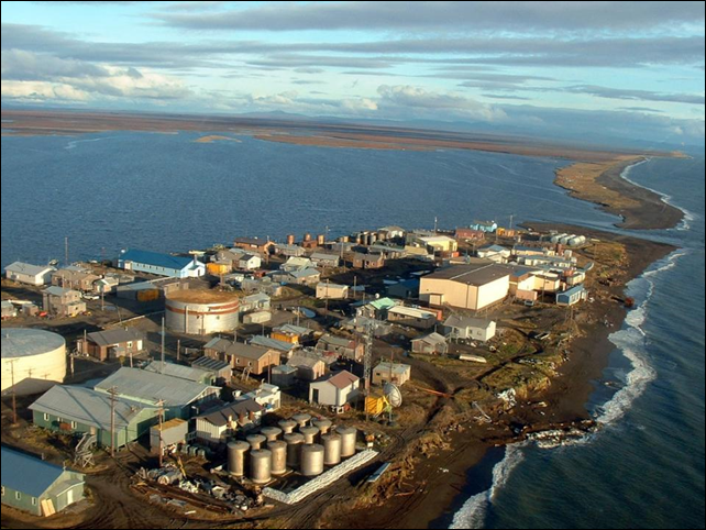 In this photo taken in September 2005 and provided by Millie Hawley, Kivalina, an Inupiat Eskimo village is seen in on a barrier island off the coast of northwest Alaska. Inupiat Eskimo villagers in the Chukchi Sea village of Kivalina rely on wild animals to survive, but a recent arrival associated with climate warming is causing health concerns. Photo: Millie Hawley / AP Photo