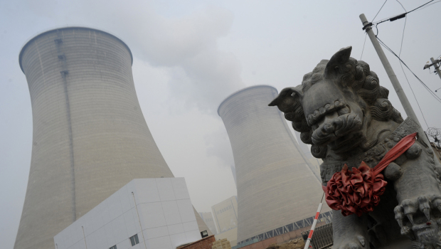 The cooling towers of a coal-powered power plant are seen in the suburbs of Beijing, 22 November 2011. China, the world's top greenhouse gas emitter, said it will push at the UN climate talks in Durban for an extension of the Kyoto Protocol, which requires rich nations to reduce their emissions. GOH CHAI HIN / AFP / Getty Images