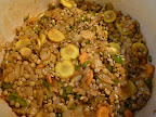 After adding the chili powder and coriander, cook for 1 minute to toast them a little, then add the lentils.