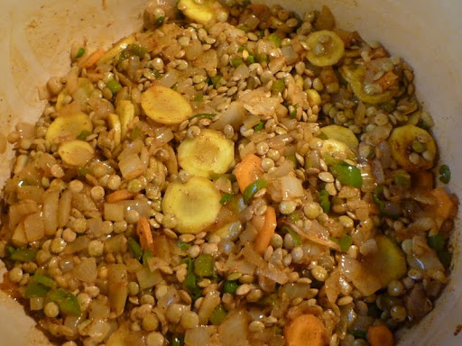 After adding the chili powder and coriander, cook for 1 minute to toast them a little, then add the lentils.
