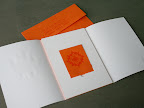 The invitation, a small matchbook, opens to reveal tiny sheets of paper with wedding details. It was meant to reflect the bonfires that'll be burning on that special festival night.