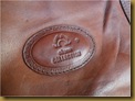 Tas kulit Charm - logo Tas kulit Charm - logo