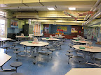 The cafeteria is designed to inspire good manners and appreciation of food, with flowers on the tables and real glasses, plates, and silverware in use.