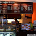 Attractive counter and overhead menu board at Coffee Dream
