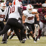 Grizzly running back Peter Nguyen is pursued by Bengals Sage Warner (#62), Taison Manu (#10), and Kimo Makaula as the referee tries to get out of the line of fire.  Nguyen was Montana's rushing leader, with 107 yards on 11 carries and one touchdown.

Washington-Grizzly Stadium in Missoula, Mont., October 27th, 2012.