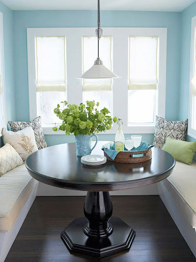 The light from these windows and the cheerful blue on the walls prove that small, cozy spaces don't need to feel stifling. via Better Homes and Gardens.