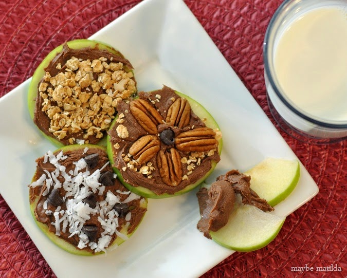 Build Your Own Apple Snack Bar with apple rings, Reese's Spreads, and toppings. Kids can top however they like for a fun, unique snack