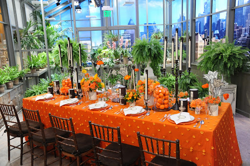 The black candlesticks add an element of drama to the table.