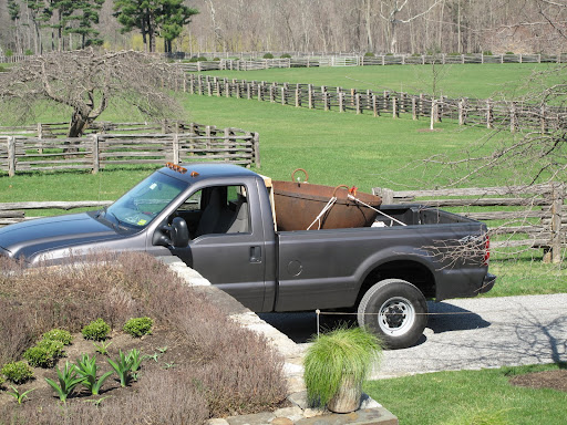 Back at the farm - now we just have to figure out how to get this thing off of the pickup.