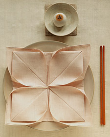 Ahhhh...the lotus: http://www.marthastewart.com/article/napkin-folding-lotus