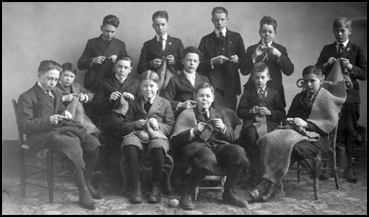 Photo of a group of boys from Cooperstown High School, who are knitting on behalf of the Red Cross, for the soldiers on the frontlines in WWl (1918) Photo | Pinterest