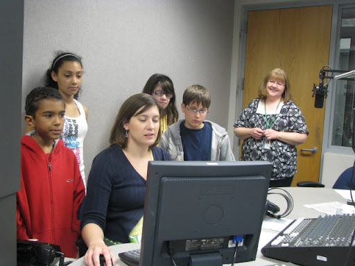 Rountree students observe the audio editing process as KSMU's Missy Shelton works on their news update.