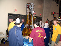 A college mentor teaching the students about the pneumatic system