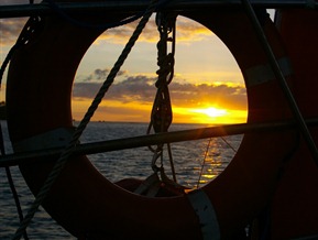 Sunset through the lifering Freewind, Fiji