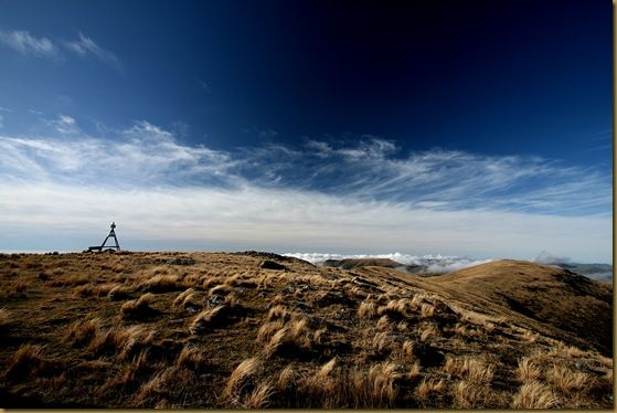 Trig point mount herbert blue skies cloud tussocks grass Trig point mount herbert blue skies cloud tussocks grass