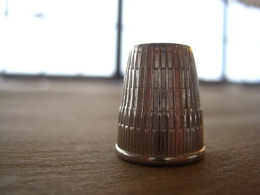 The work required him to use a thimble.