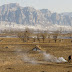 Farmer burning corn stalks beneath the Little Five-Peak Mountains near Yu Xian, Hebei.