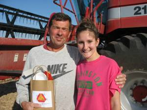 4-H’er and County Council member Bridget Nebel with farmer John Kleese working in a bean field where he stopped for his “Stay Safe, Take a Break” bag. Photo courtesy: The Washington County Extension 4-H’er and County Council member Bridget Nebel with farmer John Kleese working in a bean field where he stopped for his “Stay Safe, Take a Break” bag. Photo courtesy: The Washington County Extension