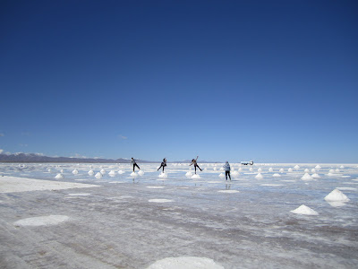 Standing on the stacks of salt - the salt miners scrape the salt into these piles to drain excess water.