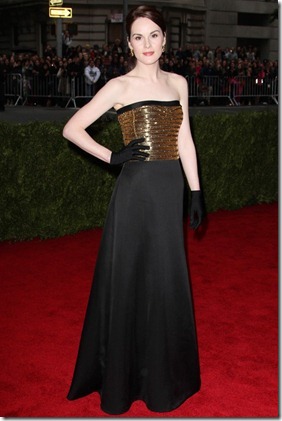 Michelle Dockery simply oozed style in her strapless, floor-length black and gold gown from Ralph Lauren.